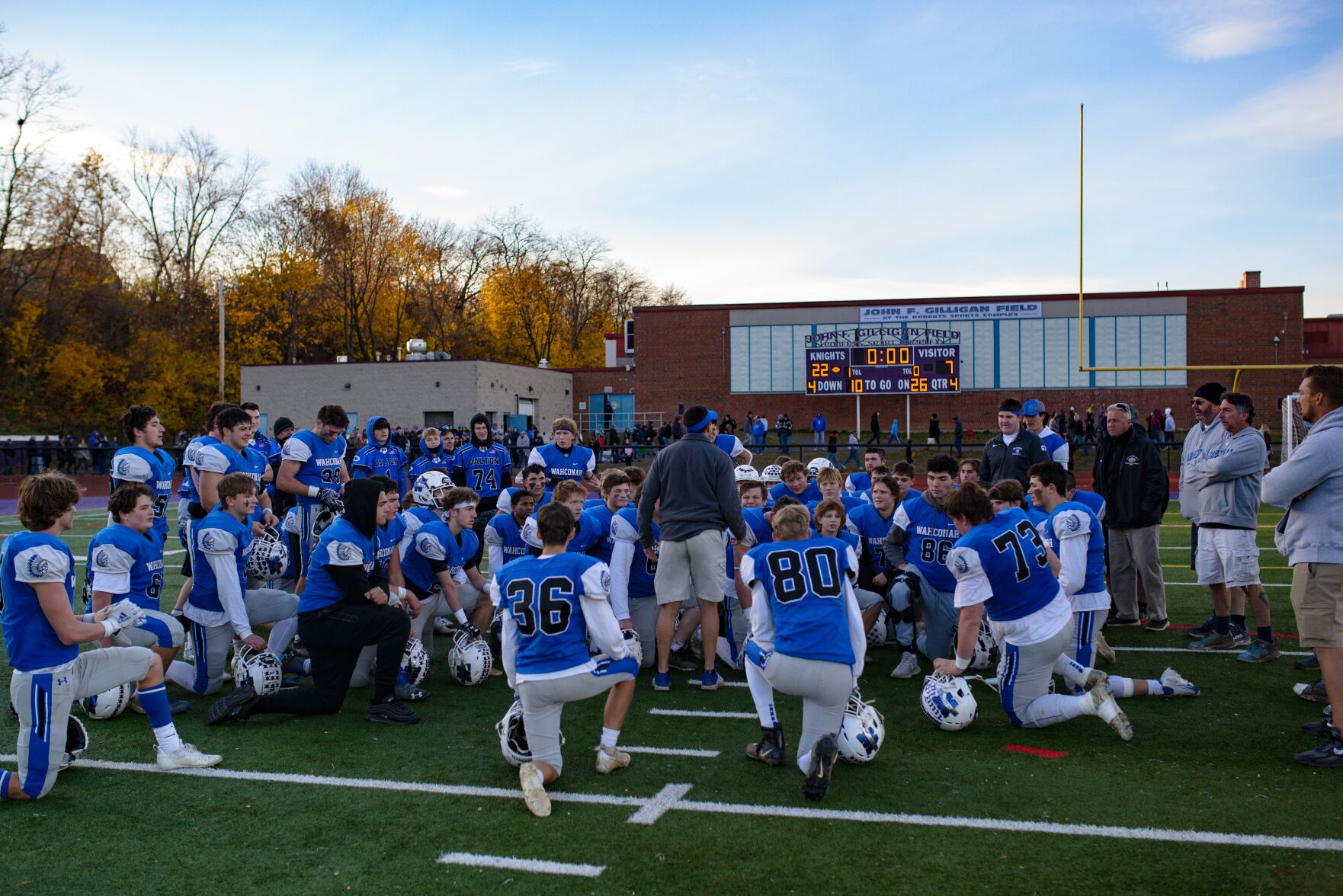 Wahconah football huddles with coach Gary Campbell